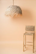 Palm fiber pendant lamp with wood chair